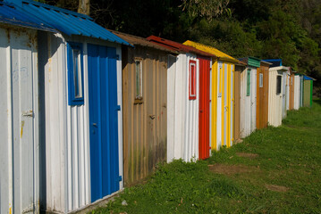 A line of colorful cabins on the beach