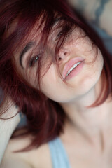 Beautiful young ginger woman with freckles. Fashion portrait of charming girl wearing casual...