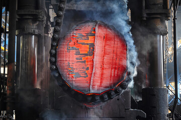 Large-capacity steel ingot is processed on a forging press. Forging production. Metallurgy
