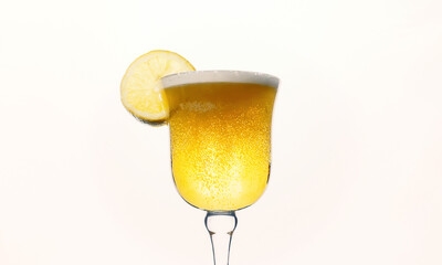A fresh yellow beer inside a fancy glass, with many bubbles, foam on top, together with a lemon slice. Isolated on a white background.
