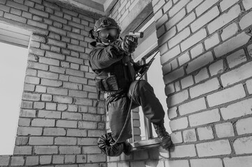 Special forces soldier storms the building. Hostage release concept. SWAT.