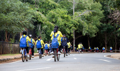 school kids bike touring parking to learn about nature