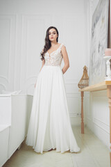 Fototapeta premium Portrait of a beautiful girl in a wedding dress