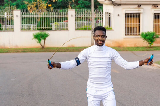 Young Black Man Using A Skipping Rope For Exercise