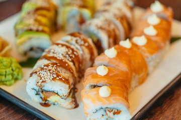 Food. Sushi rolls with eel and red fish. Close-up.