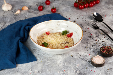 Risotto with porcini mushrooms, gray background