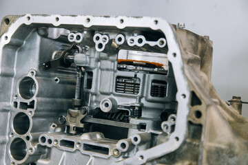 Set of various engine and gearbox spare parts. Shiny gears for planetary gearbox.Metal autotechnology background. wheel engine gears, close up. Automatic transmission in section
