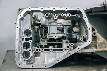 Set of various engine and gearbox spare parts. Shiny gears for planetary gearbox.Metal autotechnology background. wheel engine gears, close up. Automatic transmission in section