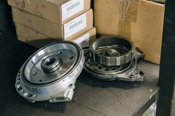 Set of various engine and gearbox spare parts. Shiny gears for planetary gearbox.Metal autotechnology background. wheel engine gears, close up. Automatic transmission in section