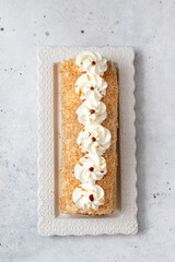 Homemade cake roll with  cream,  and  caramel and coconut. Gluten free