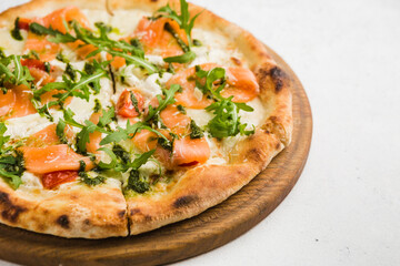 pizza with arugula and salmon