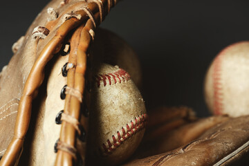 baseball in old glove closeup