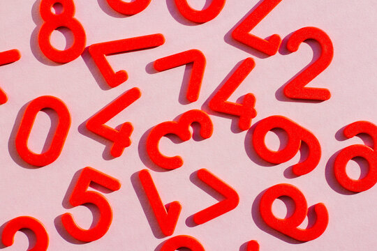 learning to count. a set of red numbers on the table. the concept of education