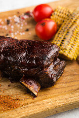 grilled smoked pork ribs with tomatoes and corn