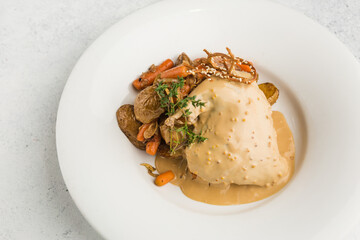 rabbit leg stewed in sour cream with carrots