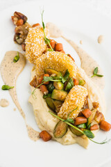 fish cakes with vegetable garnish and mashed potatoes