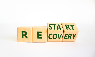 Restart and recovery symbol. Turned cubes and changed the word 'restart' to 'recovery'. Beautiful white background. Business and restart - recovery concept. Copy space.