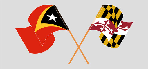 Crossed and waving flags of East Timor and the State of Maryland