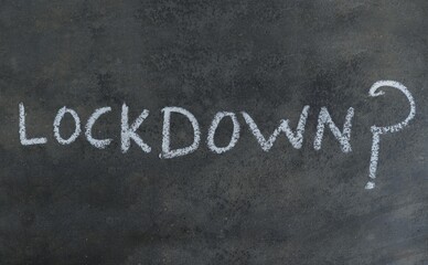 Fototapeta na wymiar Lockdown Word with Question Mark Written Blackboard with White Chalk, Lockdown Conceptual Photo Due to Coronavirus Spread