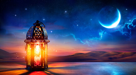 Muslim Holy Month Ramadan Kareem - Ornamental Arabic Lantern With Burning Candle Glowing At Evening...