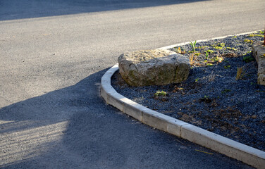 new landscaping in the village. the street flower bed is newly planted with perennials. mulching...