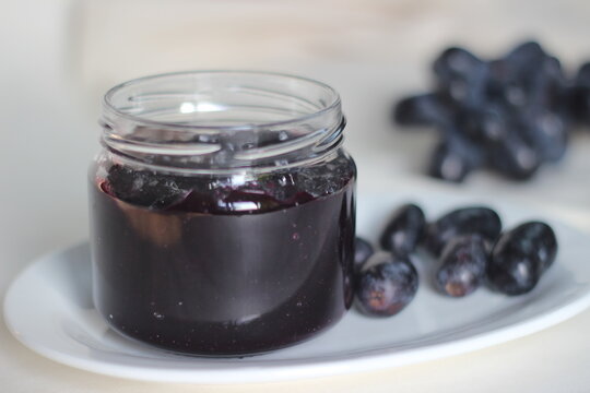 Home made Grape jam with three ingredients, seedless black grapes, sugar and lime juice.