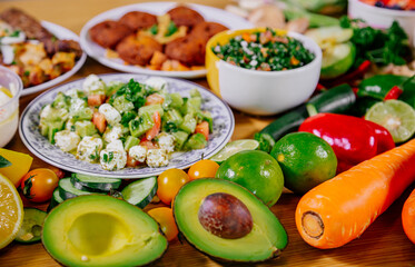 Healthy food clean eating selection: fruit, vegetable, seeds, superfood, leaf vegetable and mediterranean dishes. Detox and clean diet. Foods high in vitamins, minerals and antioxidants.