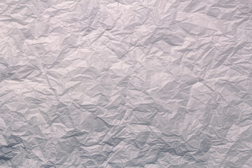 Textured clean sheet of crumpled paper white color empty background.