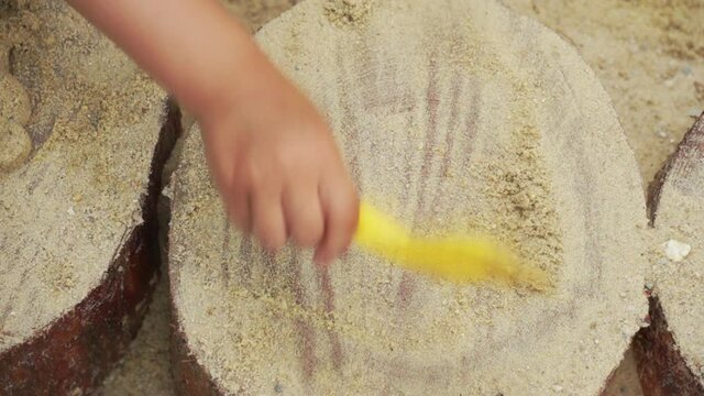 Children activity playing in sandbox playground.