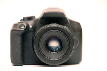 No logo digital single-lens reflex camera camera with 50 mm 1.8 aperture prime lens without hood. Front view studio shoot on white background