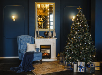 Blue chair, fireplace, Christmas tree with gifts