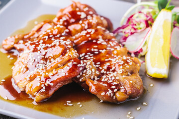 Chinese food. Chicken with sweet and sour sauce. Close-up
