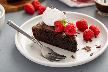 Brownie cake topped with fresh raspberries