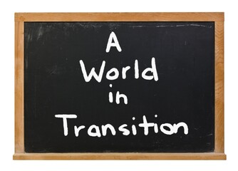 Obraz premium A world in transition written in white chalk on a black chalkboard