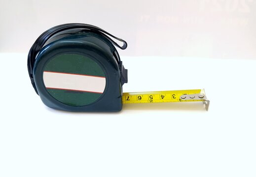 measurement tape in millimeter and inches in green color