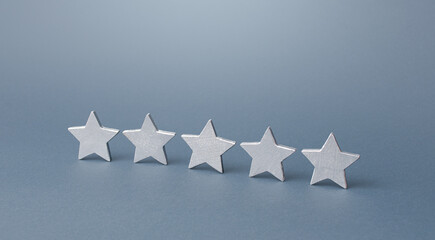Five gray stars. Rating evaluation concept. Service quality. Buyer feedback. Popularity rating of a...