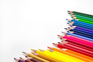 Colorful pencils on white background.