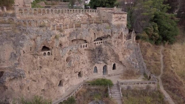 Aerial drone Landscape in Civica, a monastery cave construction in stone. An historical village, tourism destination for mystery lovers in Guadalajara, Castilla-La Mancha