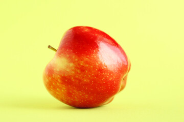 Fresh organic apple with a green background. Beautiful fresh fruit. Healthy fruit concept. Food background.