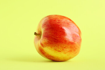 Fresh organic apple with a green background. Beautiful fresh fruit. Healthy fruit concept. Food background.