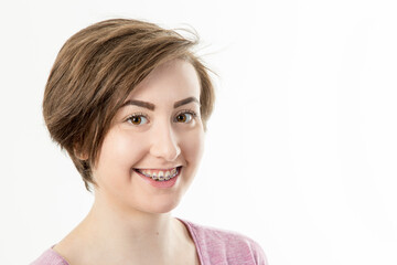 pretty dark haired teenage girl with braces smiling