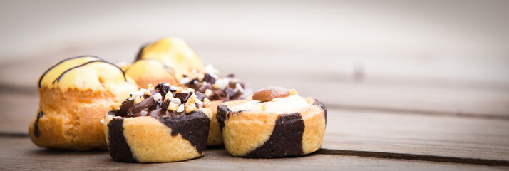 Homemade cakes on wooden background