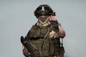 Russian military police soldier in desert uniform. Patch on the shoulder flag of Russia, arms of...