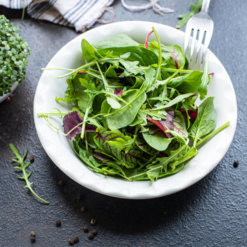 salad green mix fresh lettuce, chard, leaves arugula, spinach, iceberg, Romano salad snack healthy meal top view copy space food background rustic image keto or paleo diet vegan or vegetarian