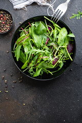 salad green mix fresh lettuce, chard, leaves arugula, spinach, iceberg, Romano salad snack healthy meal top view copy space food background rustic image keto or paleo diet vegan or vegetarian