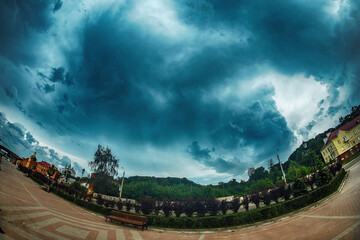 terrible clouds over the city. a sudden change in the weather. a heavy storm and thunderstorm is...