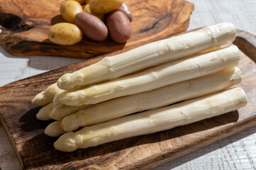 New harvest of high quality German white asparagus washed, uncooked, tasty vegetarian dinner
