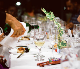 waiter serving champagne at restaurant