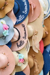 Shop with hats of various styles in the street market. Showcase with hats