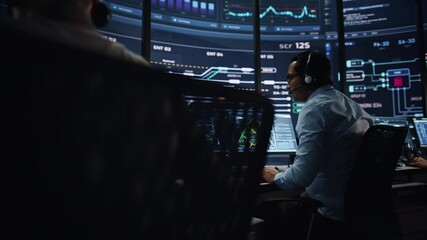 Professional IT Technical Support Specialists and Software Programmer Working on Computers in Monitoring Control Room with Digital Screens with Server Data, Blockchain Network and Surveillance Maps.  - Powered by Adobe